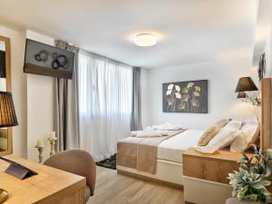Ein Bett oder Betten in einem Zimmer der Unterkunft Acropolis City Life BH