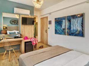 Ein Bett oder Betten in einem Zimmer der Unterkunft Acropolis City Life BH