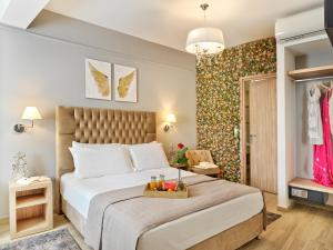 Ein Bett oder Betten in einem Zimmer der Unterkunft Acropolis City Life BH