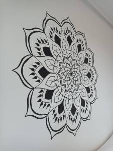 a sketch of a mandala in black and white at PALAVIA Apartments in Pavlov
