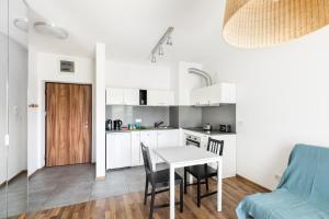Kuchyňa alebo kuchynka v ubytovaní Wagonowa P&O Apartments