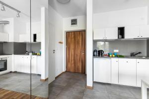 Kuchyňa alebo kuchynka v ubytovaní Wagonowa P&O Apartments