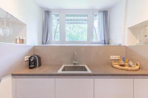 Kuchyň nebo kuchyňský kout v ubytování Husumer Wasserturm - Fewo 2