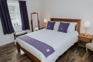 Ένα ή περισσότερα κρεβάτια σε δωμάτιο στο Fisherman's Cottage
