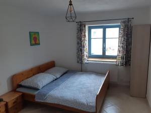 Postel nebo postele na pokoji v ubytování U Koupaliště