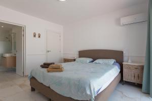Łóżko lub łóżka w pokoju w obiekcie Villa del Sol - Entre Tu y Yo