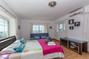 Łóżko lub łóżka w pokoju w obiekcie Villa del Sol - Entre Tu y Yo