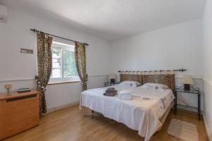 Łóżko lub łóżka w pokoju w obiekcie Villa del Sol - Entre Tu y Yo