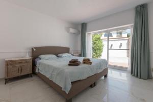 Łóżko lub łóżka w pokoju w obiekcie Villa del Sol - Entre Tu y Yo
