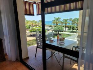 a dining room with a view of the ocean at VistaMar beautiful apartment with amazing sea view Pineda de Mar in Pineda de Mar