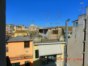 a view of a city skyline with buildings at Ami's House only for WOMEN dormer in Corfu