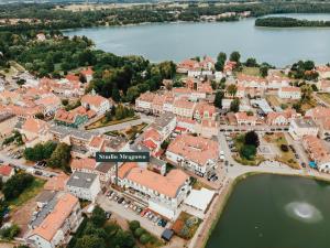 an aerial view of a town with a lake at Studio Mrągowo in Mrągowo