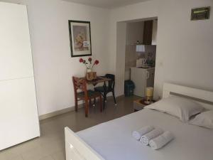 Posteľ alebo postele v izbe v ubytovaní NaLa apartments