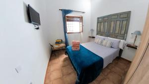 A bed or beds in a room at Apartamento Santa Leocadia