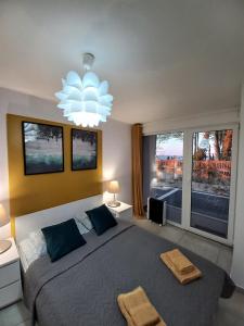 A bed or beds in a room at Apartamenty na Klifie - Apartamenty Pomorskie