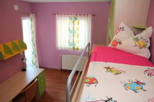 Ein Bett oder Betten in einem Zimmer der Unterkunft Villa Tonka