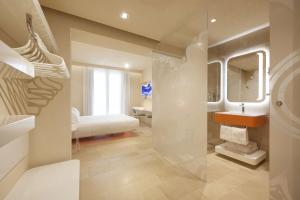 a bathroom with a sink and a mirror at Palazzo Gatto Art Hotel & SPA - BW Premier Collection in Trapani
