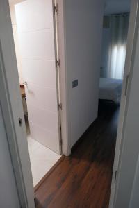a room with a closet and a bedroom with a bed at Apartament Ramon a Pobla in La Pobla de Segur