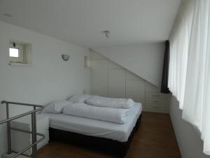 Cama ou camas em um quarto em Het Kraaijennest Miva