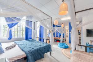 Ένα ή περισσότερα κρεβάτια σε δωμάτιο στο Homestay Vườn Pháp