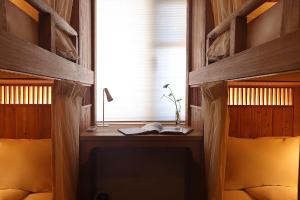 Ένα ή περισσότερα κρεβάτια σε δωμάτιο στο Hantang Inn Hostel Xi'an