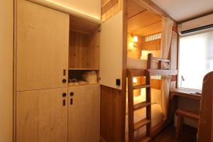 Ένα ή περισσότερα κρεβάτια σε δωμάτιο στο Hantang Inn Hostel Xi'an