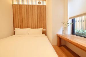 Ένα ή περισσότερα κρεβάτια σε δωμάτιο στο Hantang Inn Hostel Xi'an