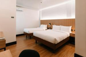 Postel nebo postele na pokoji v ubytování El Sancho Hotel