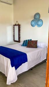 מיטה או מיטות בחדר ב-Villa Pousada