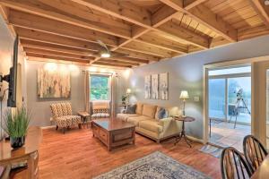 a living room with a couch and a table at Roamer's Respite - A Prime Location with Scenic Views For Your Ultimate Retreat in Sylva