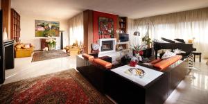 a living room with a couch and a table at La Dimora Del Bassotto in San Giuliano Terme