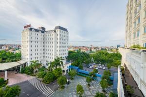 an aerial view of a city with tall buildings at Ninh Binh Legend Hotel in Ninh Binh