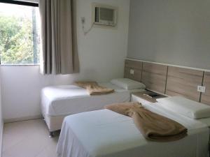 Voodi või voodid majutusasutuse Hotel Mundial toas