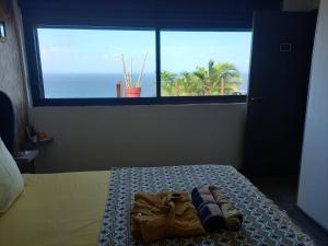 Postel nebo postele na pokoji v ubytování CHAMBRE CHEZ L HABITANT PISCINE VUE MER SDB et TERRASSE PRIVEE
