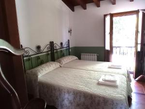 Ένα ή περισσότερα κρεβάτια σε δωμάτιο στο Casa Llano