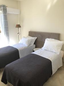 A bed or beds in a room at Venetia apartment