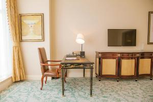 TV a/nebo společenská místnost v ubytování Qingdao Jianxin International Hotel