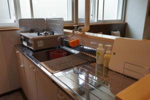 Guest House Moshiripa tesisinde mutfak veya mini mutfak
