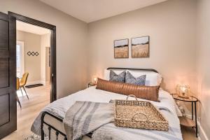 a bedroom with a bed and a mirror at Sunny Superior Home - Swim, Hike, and Explore! in Superior