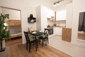 A kitchen or kitchenette at Friends Hostel & Apartments