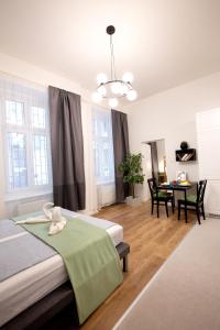A bed or beds in a room at Friends Hostel & Apartments
