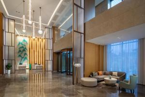 a lobby with a couch and a chair at Holiday Inn Xining Datong, an IHG Hotel in Xining