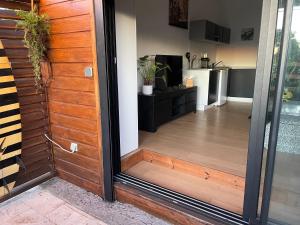 a door leading into a kitchen with a kitchen at case à roches in Saint-Gilles les Bains