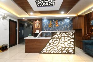 a room with a kitchen with a counter top and a counter top at Hotel Hallmark By THC Group in Kota