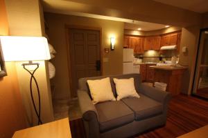 a living room with a couch and a lamp at The Village at Steamboat in Steamboat Springs