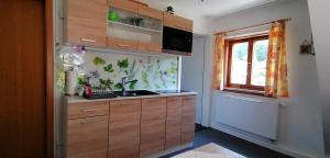 Kuchyň nebo kuchyňský kout v ubytování Ferienwohnung Müller