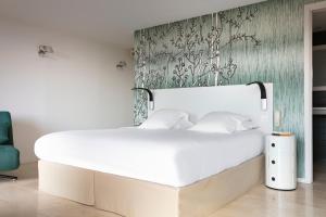 Posteľ alebo postele v izbe v ubytovaní Hotel Alcyon