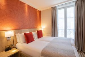 Postel nebo postele na pokoji v ubytování Prince Albert Lyon Bercy