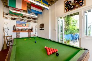 a billiard room with a pool table at The Old Coastguard Station - Bay Views & Pool Table in Falmouth