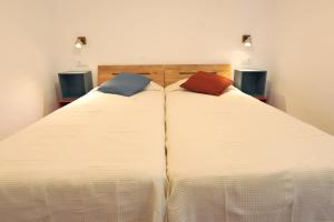 Ein Bett oder Betten in einem Zimmer der Unterkunft ROIG